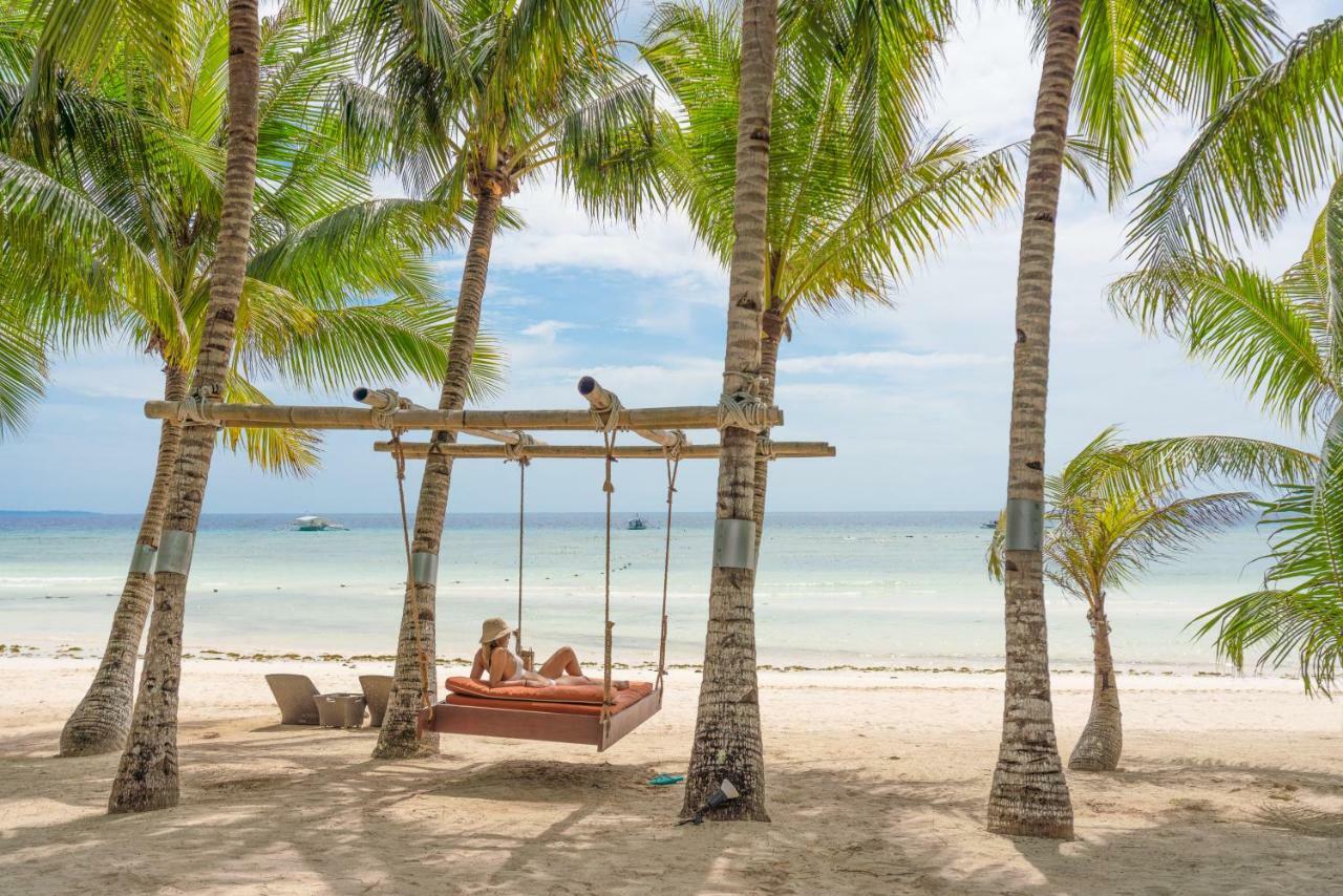 Oceanica Resort Panglao, Bohol Ngoại thất bức ảnh A swing at the beach