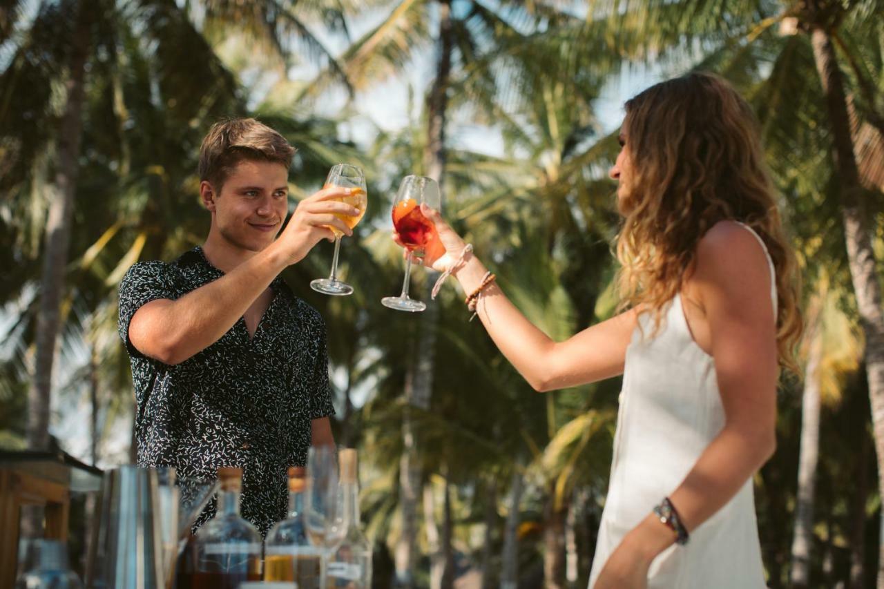 Oceanica Resort Panglao, Bohol Ngoại thất bức ảnh Two people toasting with wine